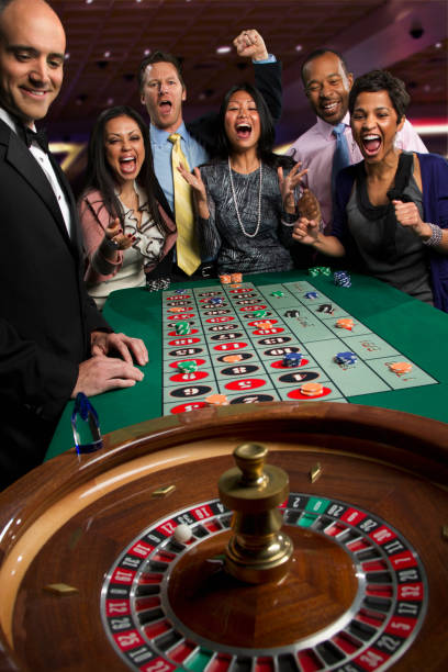bandottogel live-dealer studio with multiple table feeds displayed on screen